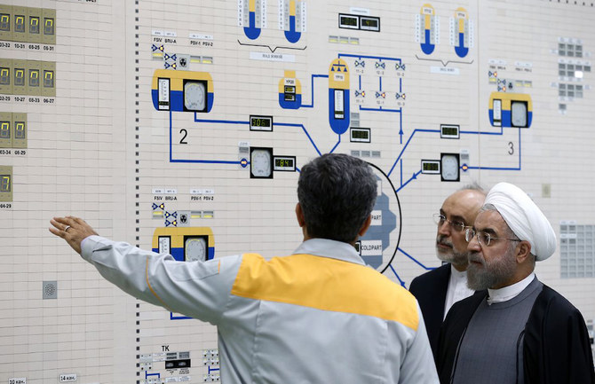 President Hassan Rouhani, right, and Atomic Energy Organization chief Ali Akbar Salehi in the control room of the Bushehr nuclear power plant. (AFP)