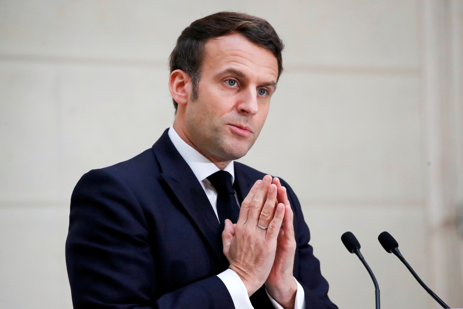 French President Emmanuel Macron delivers a speech to the French Bakery and Pastry Federation members next to the traditional epiphany cake, at the Elysee Palace, in Paris, France January 13, 2021. (Reuters)