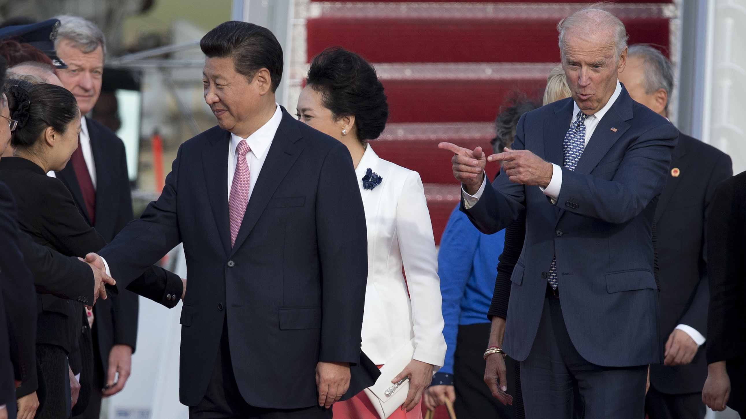 Then-Vice President Joe Biden, Chinese President Xi Jinping and his wife Peng Liyuan at Andrews Air Force Base, Maryland, Sept. 24, 2015. (AP Photo)