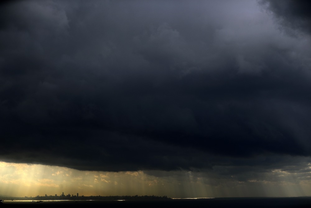 A picture taken on January 20, 2021 shows a dark cloud over the Lebanese coastal city of Jounieh, north of the capital Beirut, on a stormy day in the east Mediterranean. (AFP/File Photo)