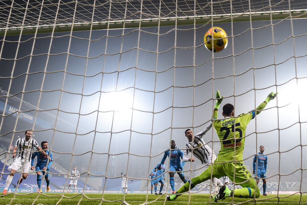 Juventus' Portuguese forward Cristiano Ronaldo (3rdR) shoots to score and open the scoring past Napoli's Colombian goalkeeper David Ospina (Front) during the Italian Super Cup (Supercoppa italiana) football match between Juventus and Napoli on January 20, 2021 at the Mapei stadium - Citta del Tricolore in Reggio Emilia. (AFP/File Photo)