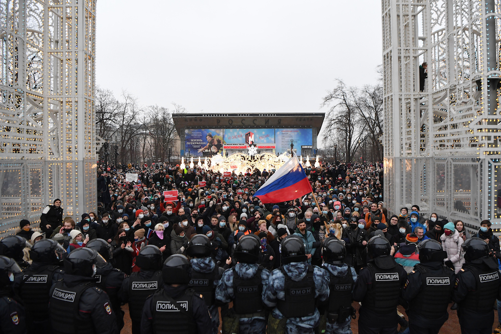 People attend a rally in support of jailed opposition leader Alexei Navalny in downtown Moscow on January 23, 2021. - Navalny, 44, was detained last Sunday upon returning to Moscow after five months in Germany recovering from a near-fatal poisoning with a nerve agent and later jailed for 30 days while awaiting trial for violating a suspended sentence he was handed in 2014. (AFP/File Photo)