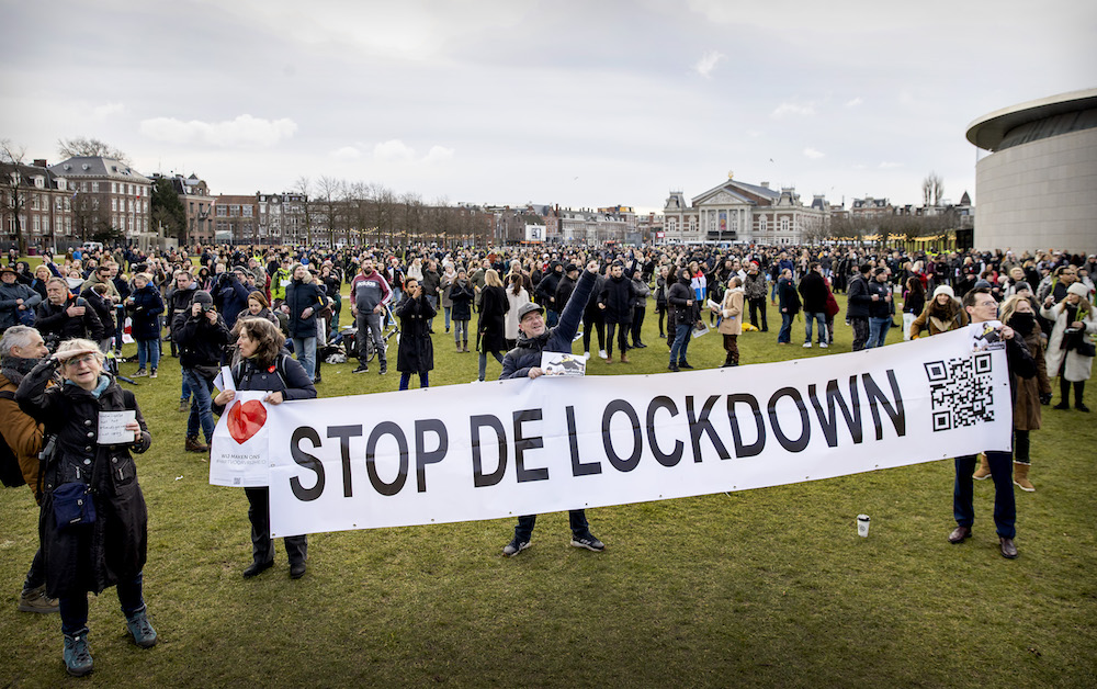 People gather at Amsterdam's Museumplein during a portest against the lockdown imposed to curb the spread of the Covid-19 pandemic and the outgoing government's policy, on January 21, 2021. (AFP/File Photo)