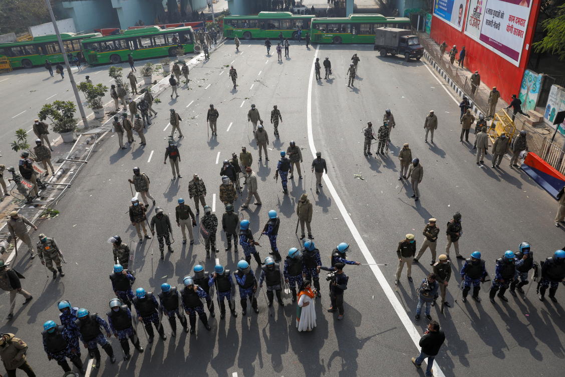 Police officers stand guard during a protest against farm laws introduced by the government, in New Delhi, India, January 26, 2021. REUTERS/Adnan Abidi