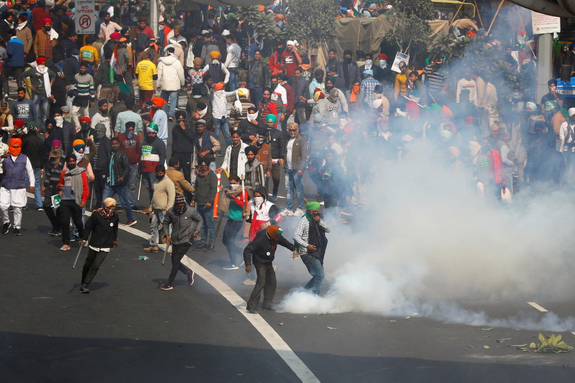 Police use tear gas to disperse demonstrators during a protest against farm laws introduced by the government, in New Delhi, India, January 26, 2021. REUTERS/Adnan Abidi