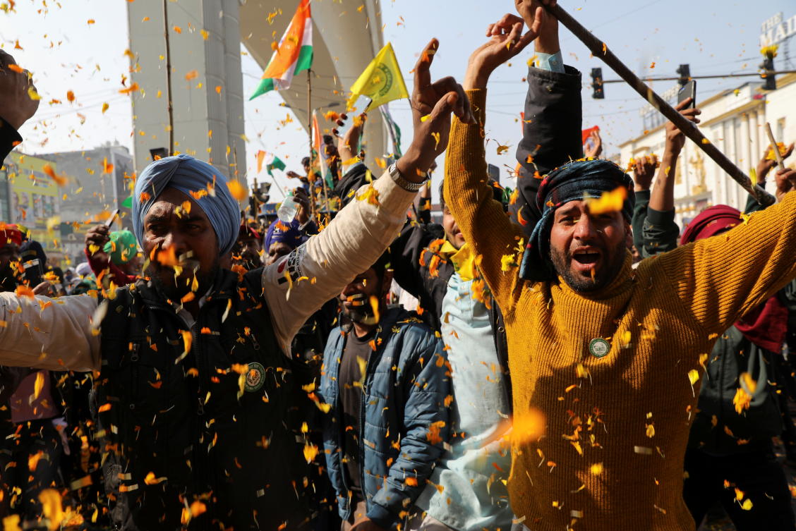 Farmers are showered with flower petals as they head thowars Delhi during a tractor rally to protest against farm laws on the occasion of India's Republic Day at Tikri border near New Delhi, India, January 26, 2021. REUTERS/Anushree Fadnavis