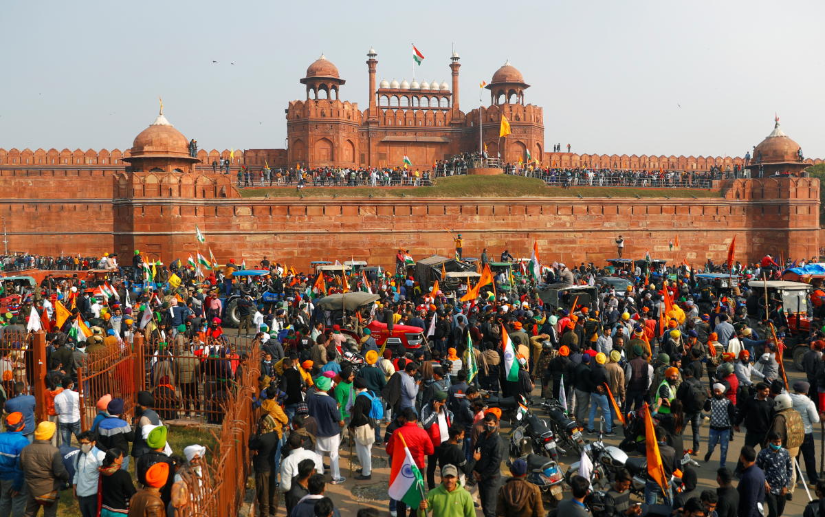 Farmers gather in front of the historic Red Fort during a protest against farm laws introduced by the government, in Delhi, India, January 26, 2021. REUTERS/Adnan Abidi