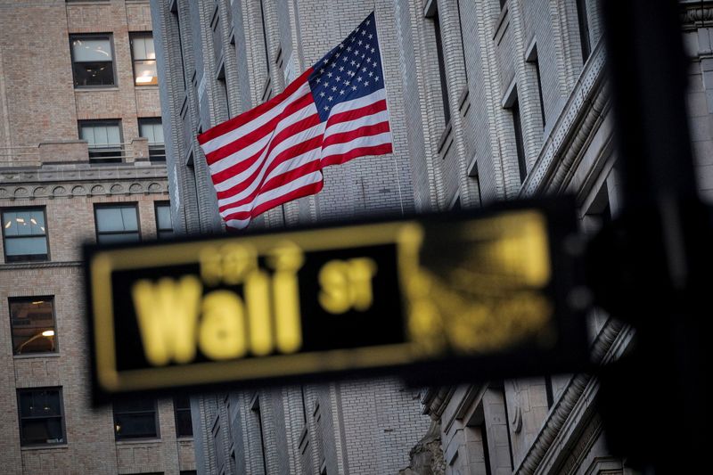 The U.S. flag flies on Wall St., in New York’s financial district. (Reuters)