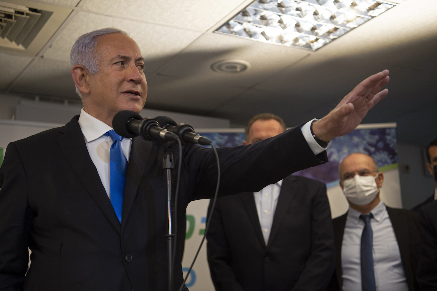 Israeli Prime Minister Benjamin Netanyahu visits a coronavirus vaccination facility in the northern Arab city of Nazareth, Israel, Wednesday, Jan. 13, 2021. (AP)