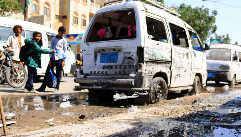 A damaged van is pictured following an explosion at a nearby wedding hall during the night in the Yemeni Red Sea city of Hodeidah, on January 2, 2021. (AFP)
