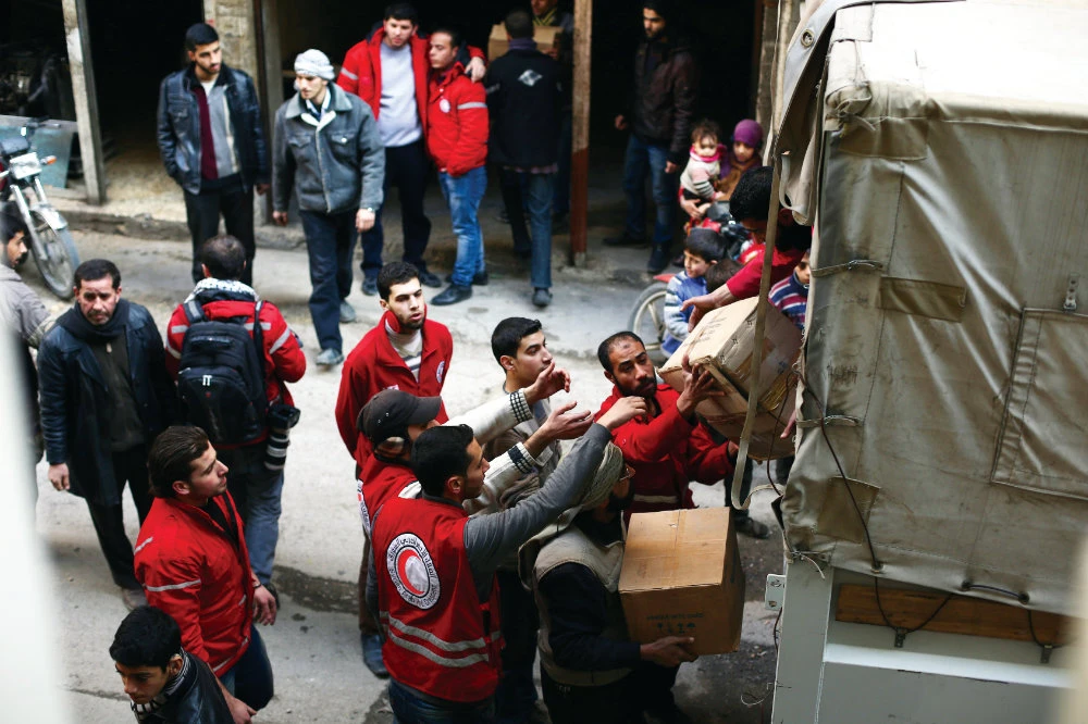 The WHO COVAX facility is trying to solve the problem of distributing urgent COVID-19 vaccines to some of the world’s hardest- hit countries, including Syria. (AFP)