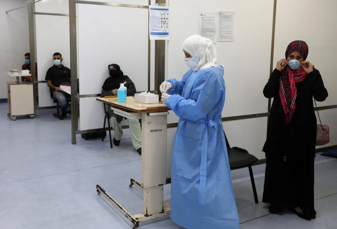 People wait to get tested for the coronavirus disease (COVID-19), at Rafik Hariri University Hospital, in Beirut, Lebanon January 4, 2021. Picture taken January 4, 2021. (Reuters)