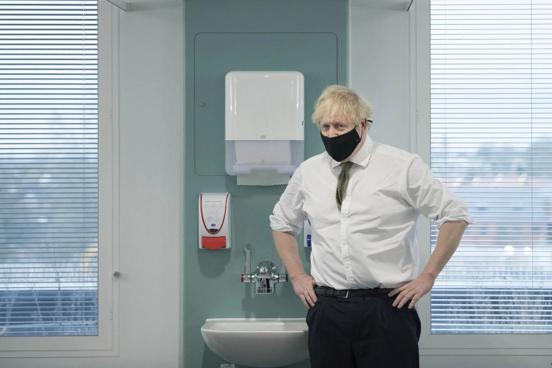 Britain’s Prime Minister Boris Johnson during a visit to view the vaccination program at the Chase Farm Hospital in north London, Monday, Jan. 4, 2021. (AP Photo)