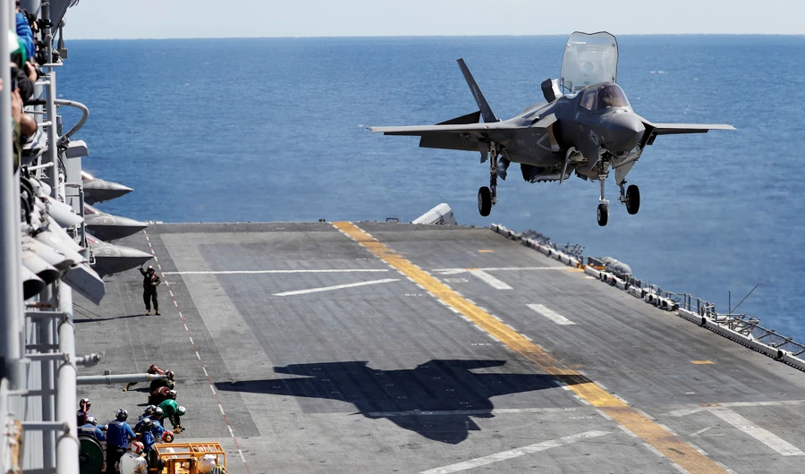 A Marine Corps pilot prepares for a vertical landing of Lockheed Martin F-35B stealth fighter aboard the USS Wasp amphibious assault carrier during their operation in the waters off Japan's southernmost island of Okinawa March 23, 2018. (REUTERS)