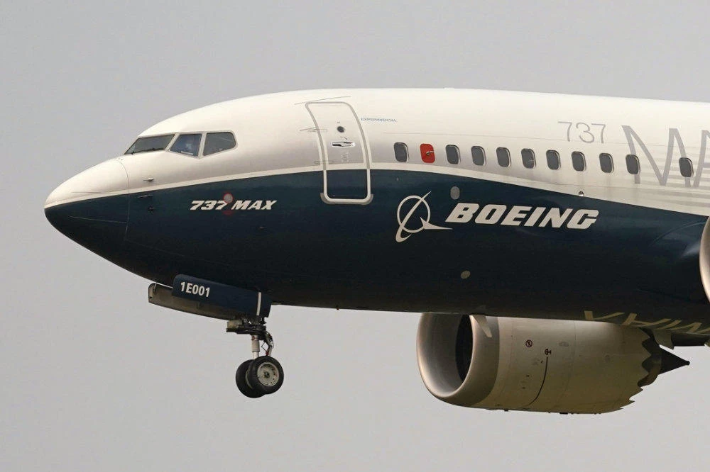 Nearly two years after the second of two crashes involving Boeing 737 Max planes that killed 346 people in all, Boeing is agreeing to pay money for crash victims' families, airline customers and airlines, as well as a fine. (AP Photo/Elaine Thompson, File)