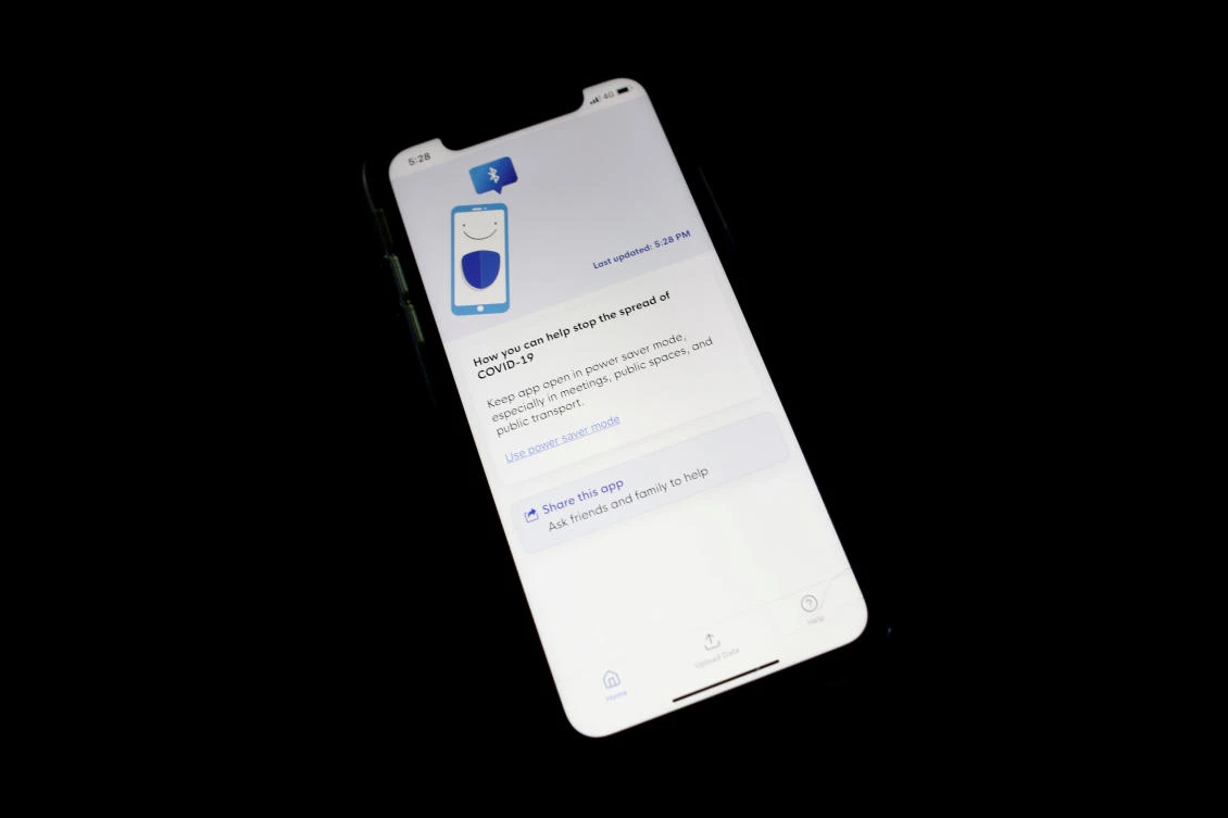 Above, the contact tracing app TraceTogether, released by the Singapore government to curb the spread of the coronavirus disease, is seen on a mobile phone. (Reuters)