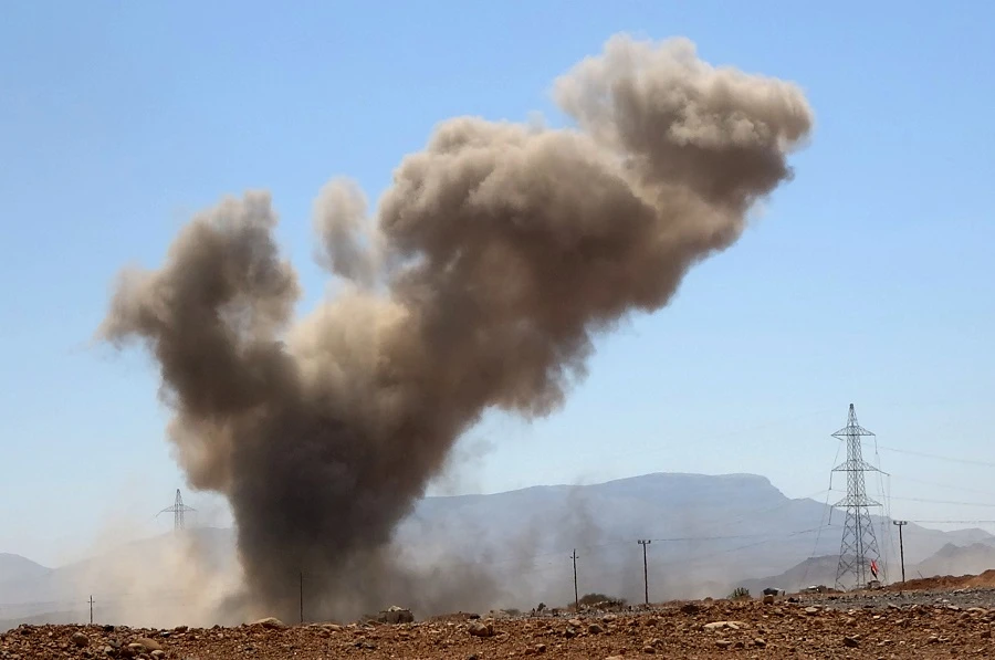 A smoke plume rises following an explosion as forces loyal to Yemen's Saudi-backed government clash with Houthi rebel fighters around the strategic government-held "Mas Camp" military base, in al-Jadaan area about 50 kilometres northwest of Marib in central Yemen, on November 22, 2020. (File/AFP)