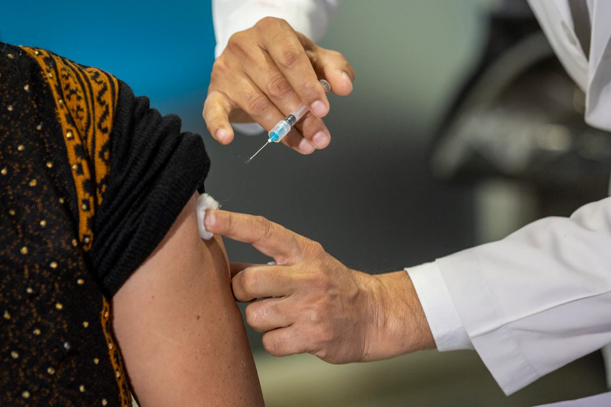A health worker performs a trial run of the COVID-19 vaccine delivery system in New Delhi, India, Friday, Jan. 8, 2021. (AP)