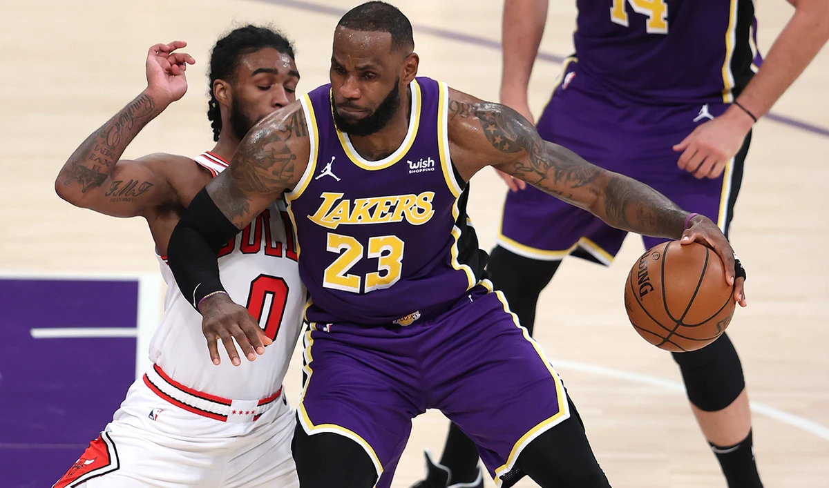 LeBron James of the Los Angeles Lakers dribbles past Coby White of the Chicago Bulls during their game at Staples Center in Los Angeles. (AFP)