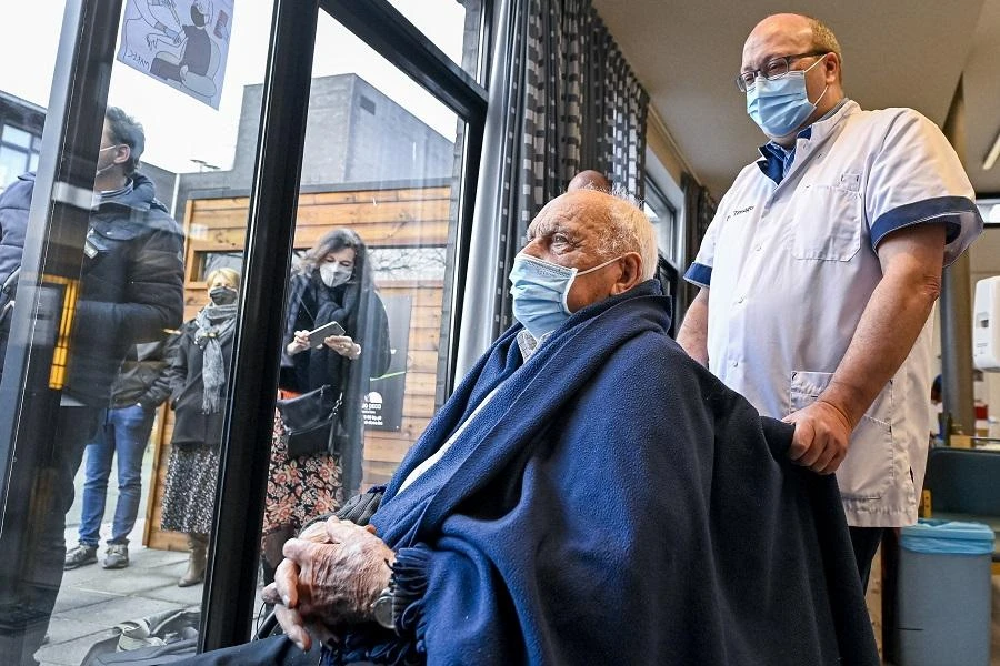 Jos Hermans, 96, who is the first to receive a Pfizer-BioNTech Covid-19 vaccine poses for journalists during a vaccination operation at the "Woonzorgcentrum Sint-Pieters" rest home on December 28, 2020 in Puurs, in Belgium's Flemish region. (File/AFP)