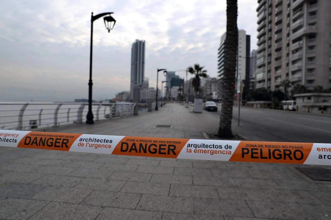 A view of Beirut's waterfront promenade sits deserted and sealed off by police tape as Lebanon starts a new three-week lockdown amid a record post-holiday surge of new coronavirus cases that has overwhelmed the country's health sector Thursday, Jan. 7, 2021. (AP Photo/Bilal Hussein)