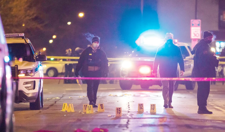 Chicago and Evanston police at the crime scene after a gunman went on a shooting spree before being killed by police during a shootout in Evanston, Ill. (AP)