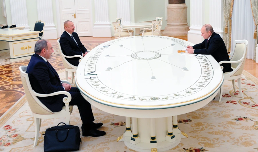 Russian President Vladimir Putin, right, speaks with Azerbaijan’s President Ilham Aliyev, center, and Armenian Prime Minister Nikol Pashinyan in Moscow. (AP)