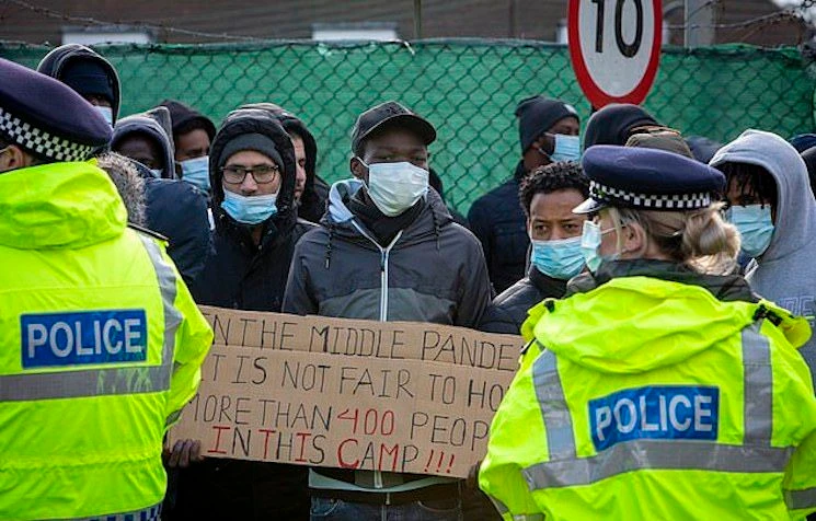 Asylum seekers protest conditions in UK military camp