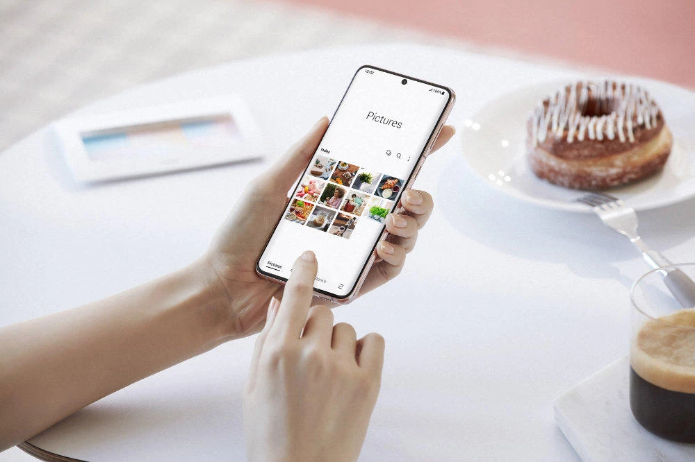 This photo provided by Samsung shows the Galaxy S21 Plus. Samsung's next crop of smartphones will boast bigger screens, better cameras, and longer-lasting batteries at lower prices than than last year's lineup that came out just before the pandemic toppled the economy. (Samsung via AP)