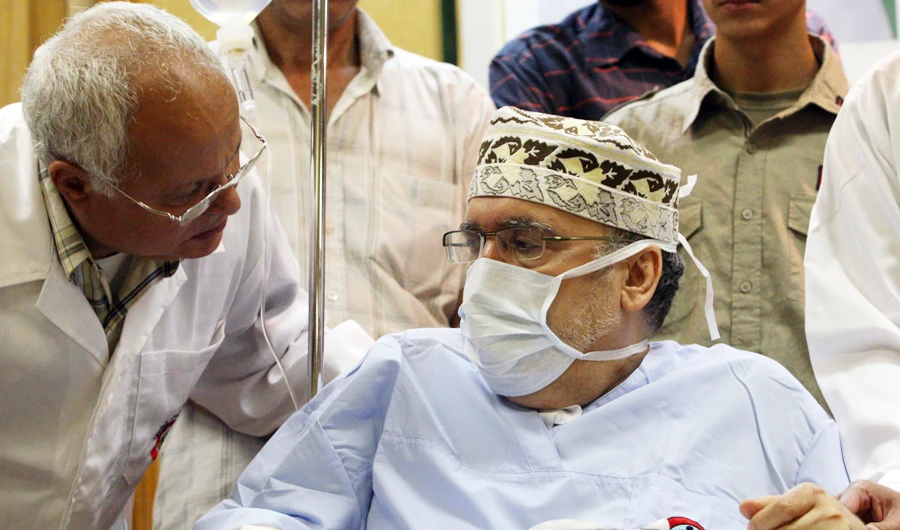 Abdelbaset Ali Mohmet Al-Megrahi speaks to a doctor during a meeting with an African delegation at a hospital in Tripoli on Sept. 9, 2009. (AFP)
