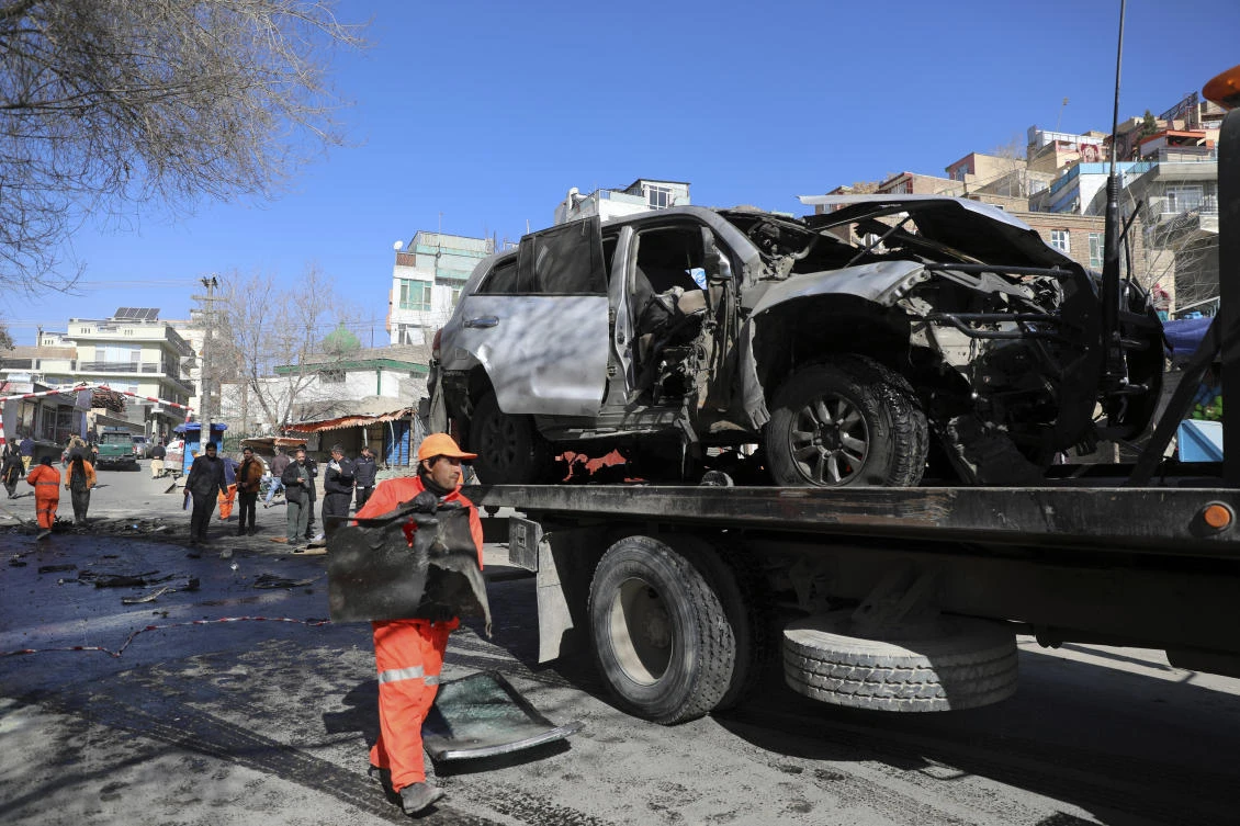 Afghan security personnel remove a damaged vehicle after a bomb attack in Kabul, Afghanistan, Saturday, Jan. 16, 2021. (File/AP)