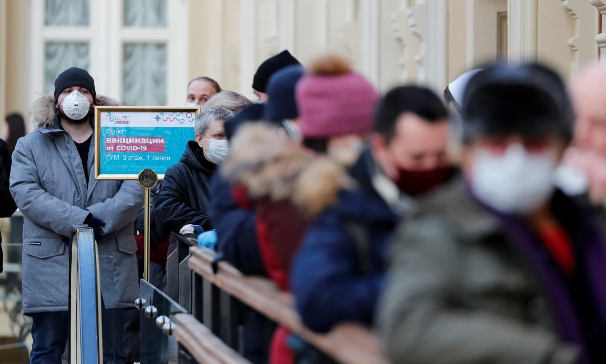 People line up to receive a dose of Sputnik V (Gam-COVID-Vac) vaccine against the coronavirus disease (COVID-19) at a vaccination center in the State Department Store, GUM, in central Moscow, Russia January 18, 2021. (Reuters)