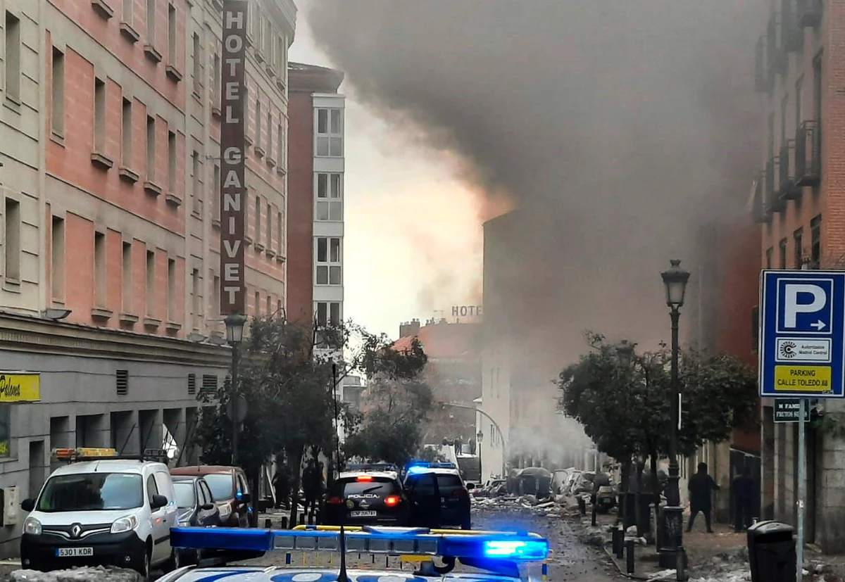Smoke rises from a building and rubble scattered in Toledo Street following a explosion in downtown Madrid, Spain, Wednesday, Jan. 20, 2021. (AP)