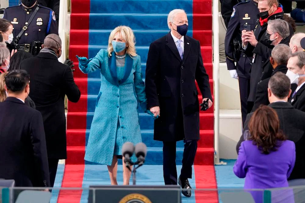 US President-elect Joe Biden flanked by wife Dr. Jill Biden arriving for his inauguration as the 46th US President. (AFP)