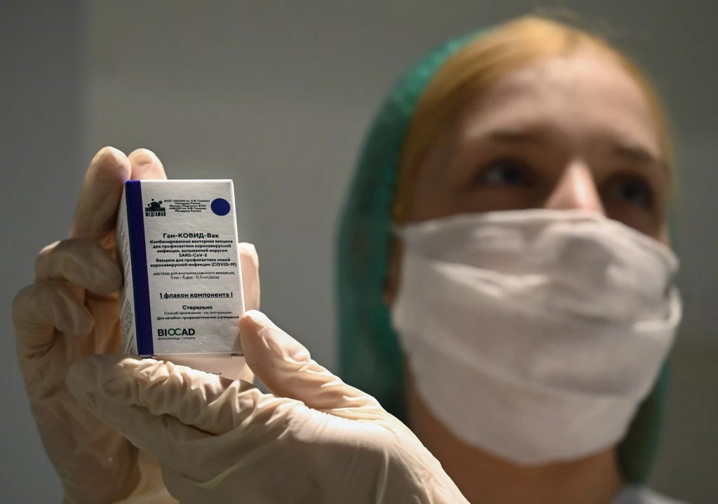 A medical worker holds a box with a vial of Russia’s Sputnik V (Gam-COVID-Vac) coronavirus vaccine in Moscow on Jan. 18, 2021. (AFP)