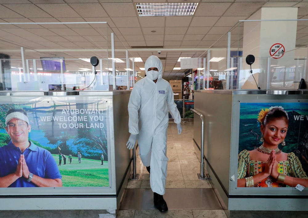 A security officer wearing protective gear at Bandaranaike International Airport, Katunayake, Sri Lanka, Jan. 20, 2021. (Reuters)
