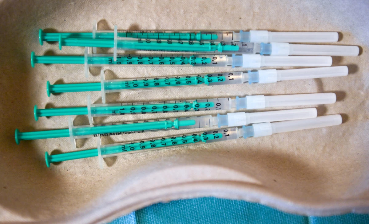 Pharmacist Susanne Wohlgemuth prepares Pfizer/BioNTech COVID-19 vaccinations at the Haus an der Linde nursing home in Lichtentanne, Saxony, Germany December 27, 2020, the day when the country starts its vaccination programme. (Reuters)