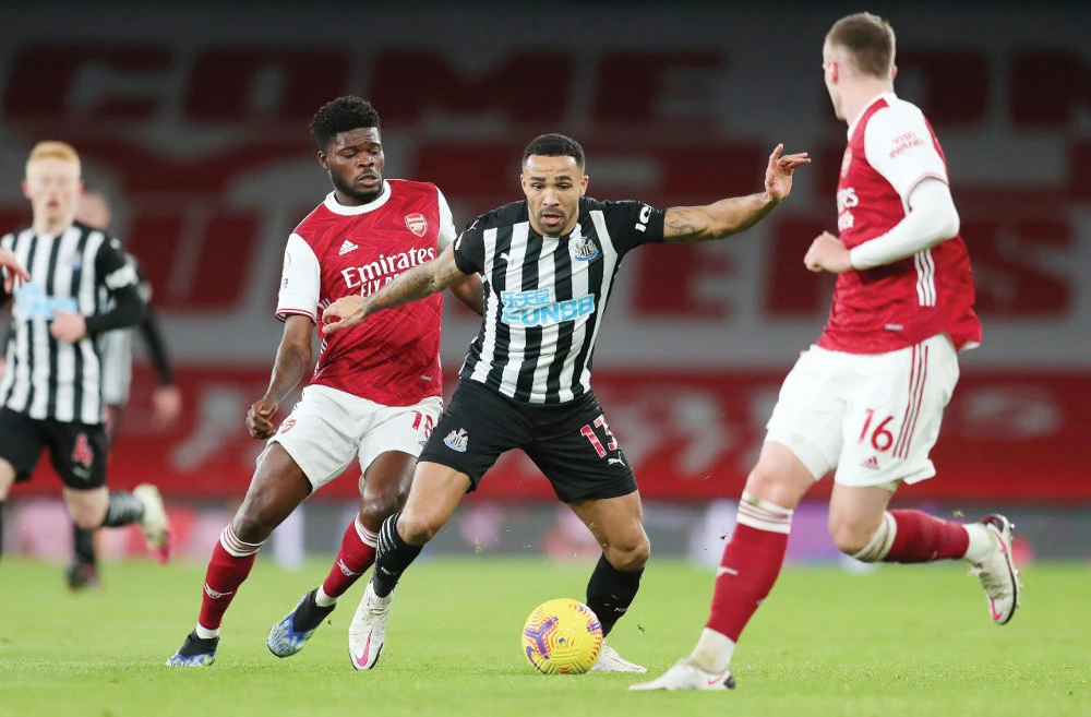 Arsenal’s Thomas Partey vies for the ball with Newcastle United’s Callum Wilson during a Premier League match in London on Monday. (Reuters)