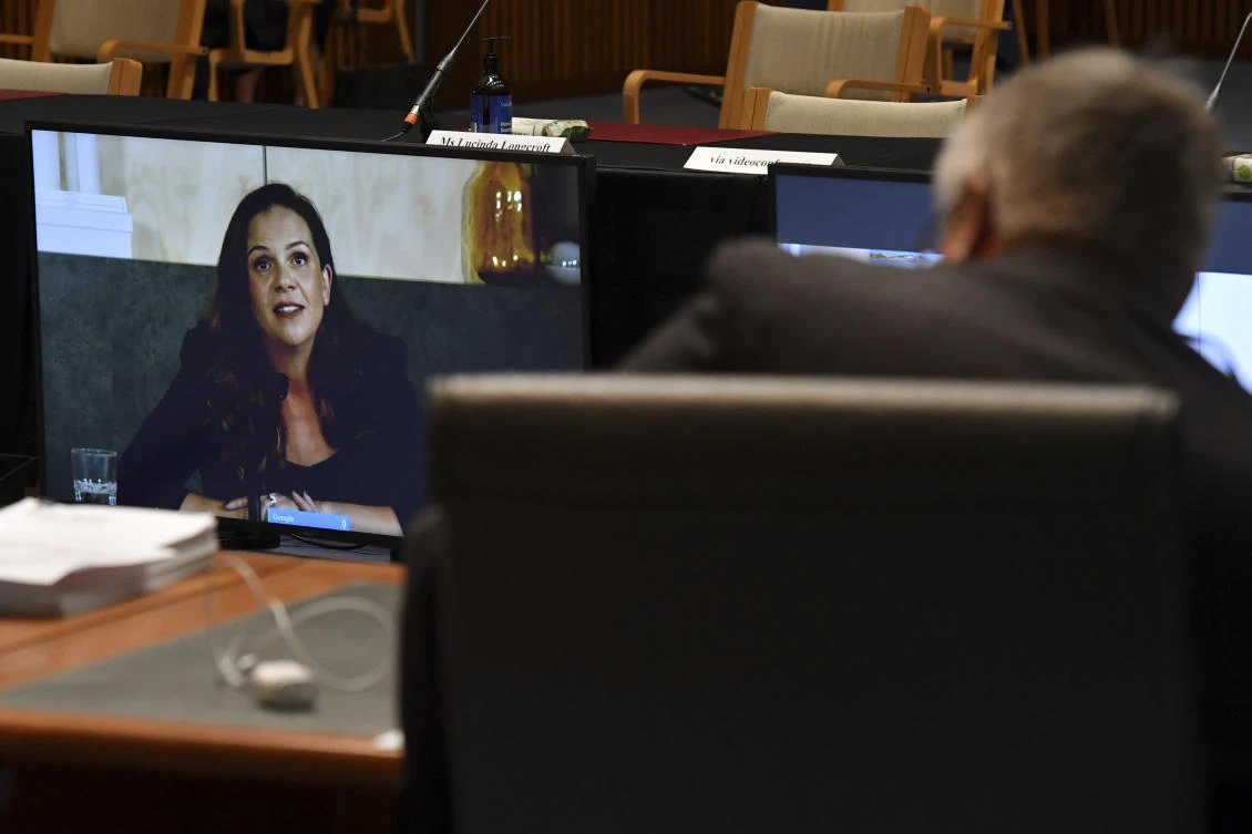 Mel Silva, left, the managing director of Google Australia and New Zealand, appears via a video link during a Senate inquiry into a mandatory code of conduct proposed by the government at Parliament House in Canberra on Jan. 22, 2021. (AAP Image via AP)