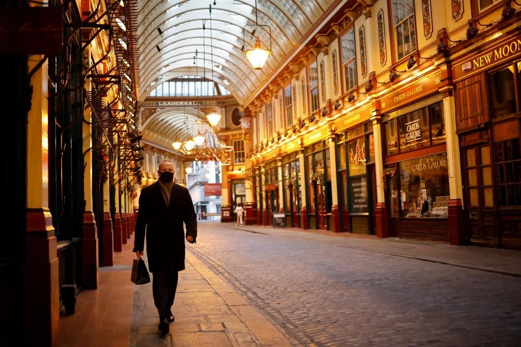 Lone pedestrian walks through Leadenhall market in the City of London, as Britain enters a national lockdown in London on Jan. 5, 2021. (File/AFP)