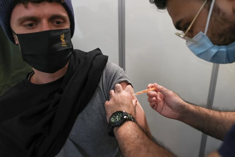 A person receives the Oxford/AstraZeneca coronavirus disease (COVID-19) vaccine at an NHS vaccination centre in York, Britain, January 22, 2021. (Reuters)