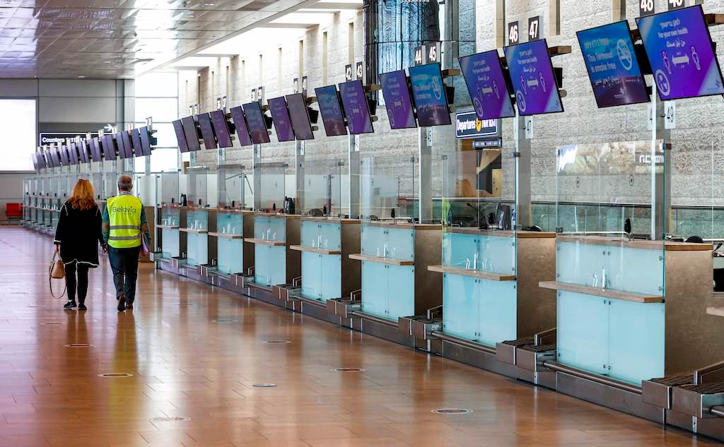 This picture taken on January 24, 2021 shows a view of the empty departure check-in counter for Israel flag carrier El Al at Israel's Ben Gurion Airport in Lod, east of Tel Aviv. (AFP)