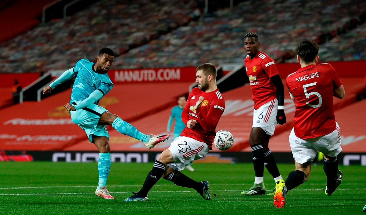 Liverpool’s Georginio Wijnaldum, left, shoots at goal during Sunday’s match. (AFP)