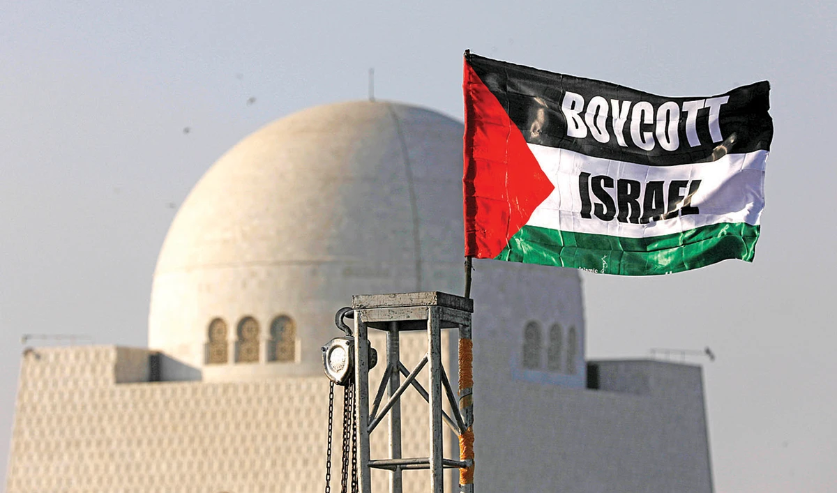 A Palestinian flag emblazoned with an anti-Israel slogan flutters during a rally in Karachi. (Reuters)