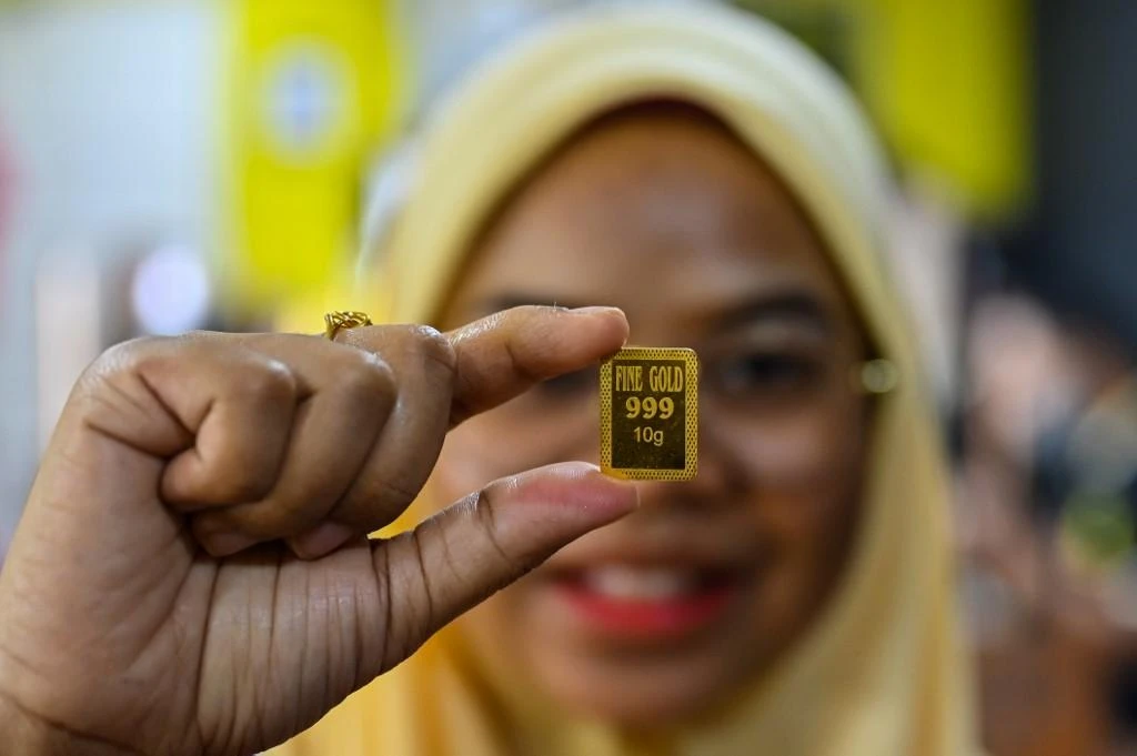 Gold is considered a hedge against inflation, likely from widespread stimulus. (AFP)