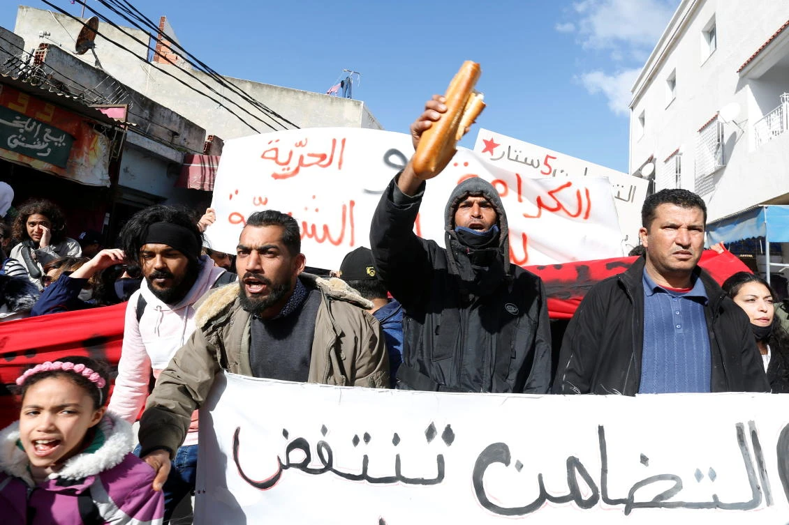 Tunisians protest arrests; government faces confidence vote