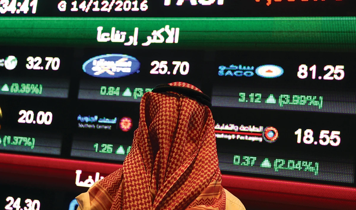 A Saudi investor monitors the stock exchange at the Saudi Stock Exchange in Riyadh. (AFP)