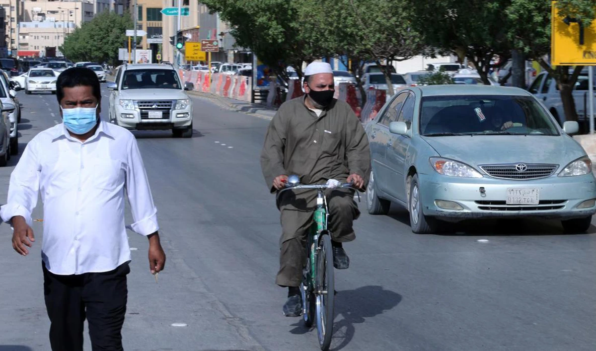 People wear protective masks on a street in the Saudi capital Riyadh. (Reuters/File)