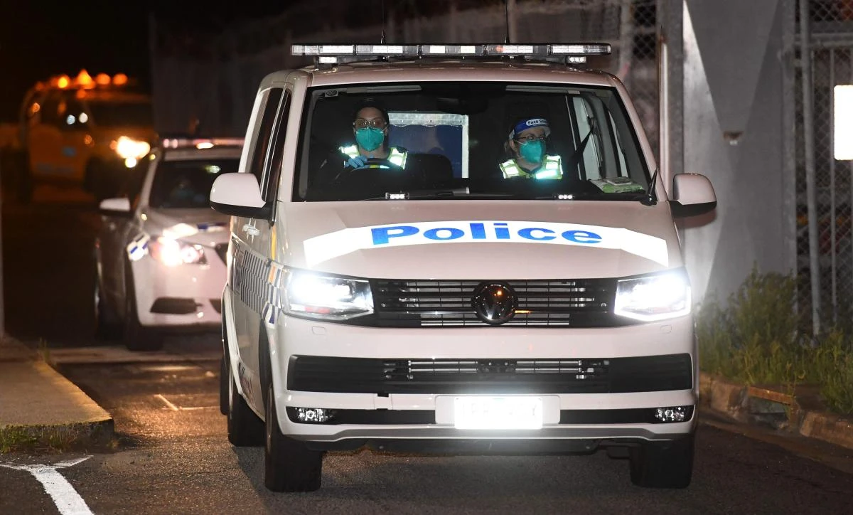 A police van leaves Melbourne Airport as Malka Leifer, a former principal at a Jewish ultra-Orthodox school, is returned to Australia under extradition on Jan. 27, 2021 to face dozens of charges of child sexual assault. (AFP)