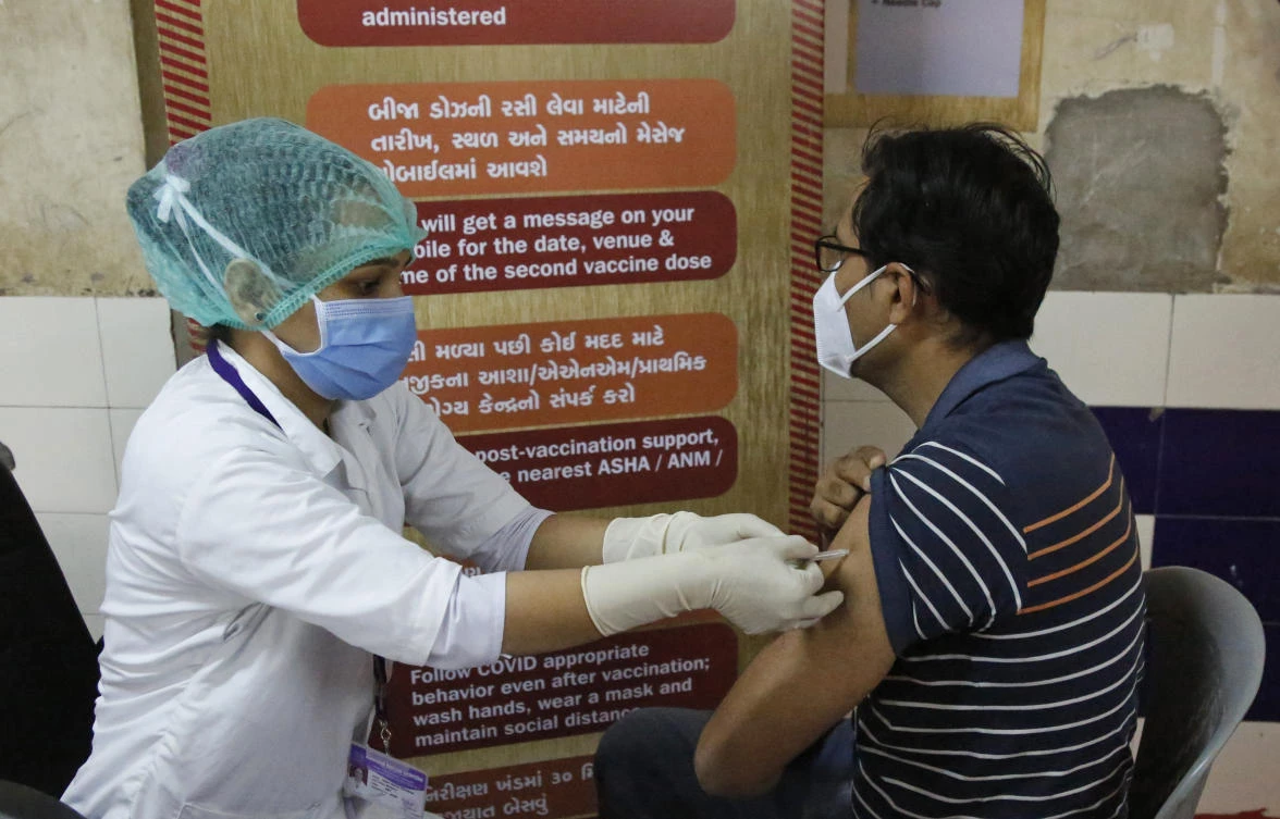 A health worker administers a COVID-19 vaccine to a hospital staff at a vaccination Centre in Ahmedabad, India, Thursday, Jan. 28, 2021. (AP)